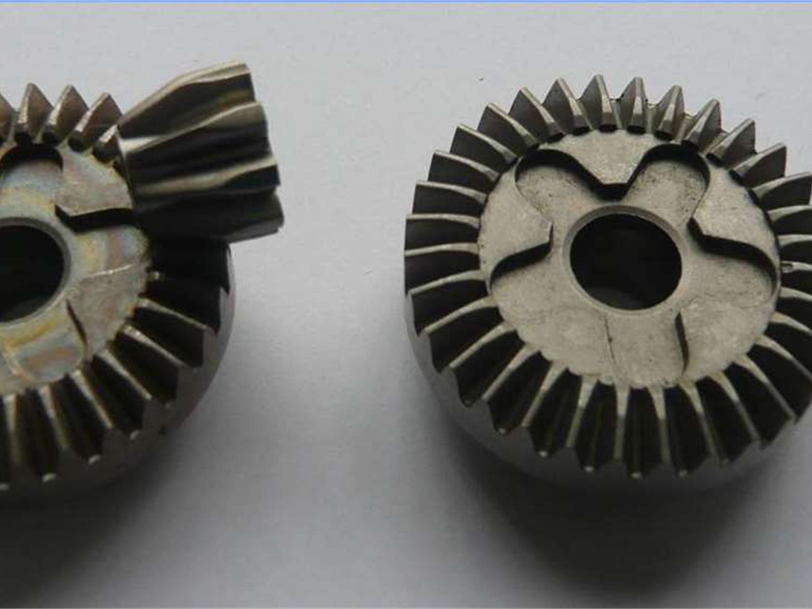 Automotive powder metallurgy bevel gears and drivetrain components