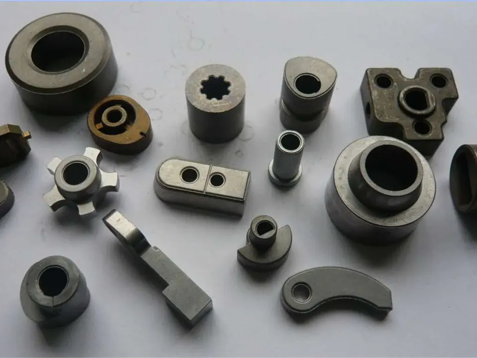 Structural powder metallurgy parts including hubs, cams, brackets and bearing housings